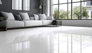 A person buffing a hardwood floor with a soft cloth to repair minor scratches.